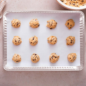 PLASTICPRO sheet pan with pizza for crisp, even baking.