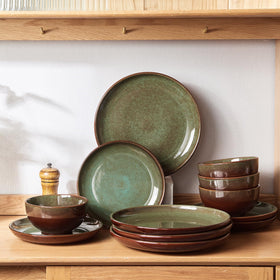 Pokini stackable stoneware plates with coupe edges to save cabinet space.