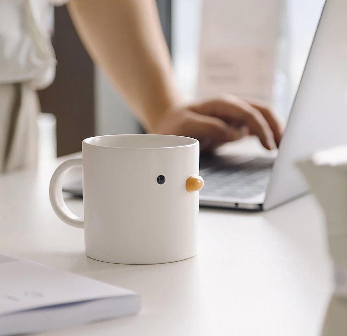 Chick mug on home or office desk creates a cozy vibe.