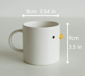 Matte ceramic duck mug emphasizes comfortable grip for daily use.