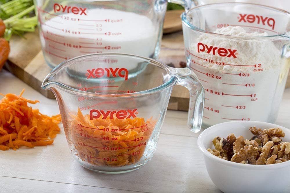 Pyrex Essentials cups display bold red measurements for quick, accurate prep.