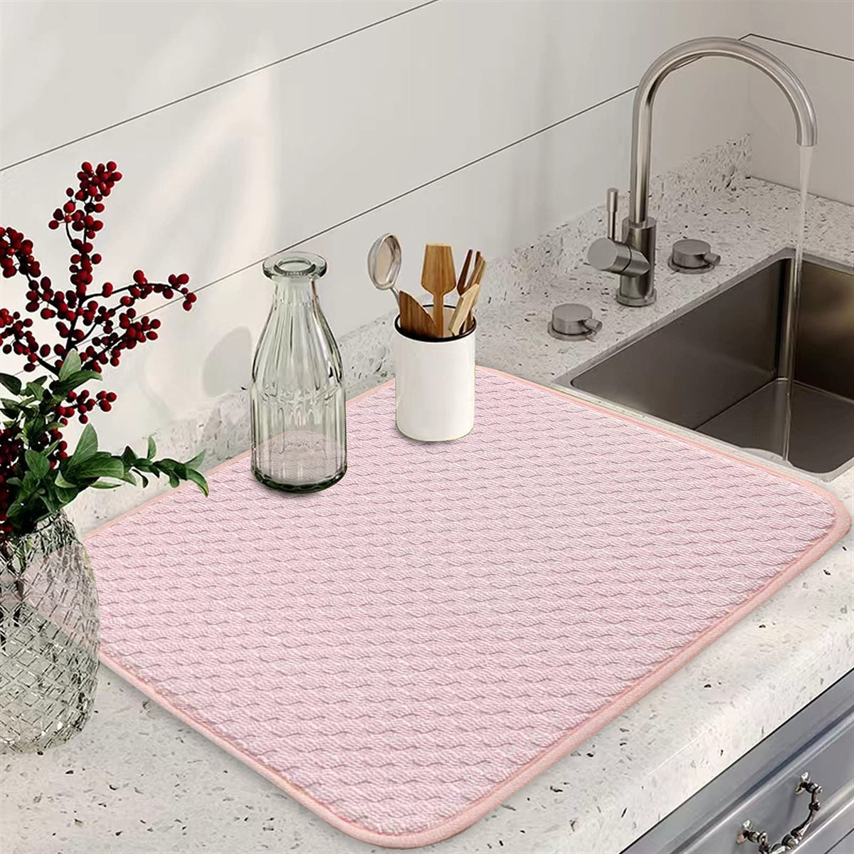 QGWJEKUI pink dish drying mats folded for compact storage after use.