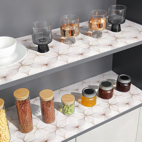 Quttisay waterproof shelf liner protects surfaces from spills and stains.