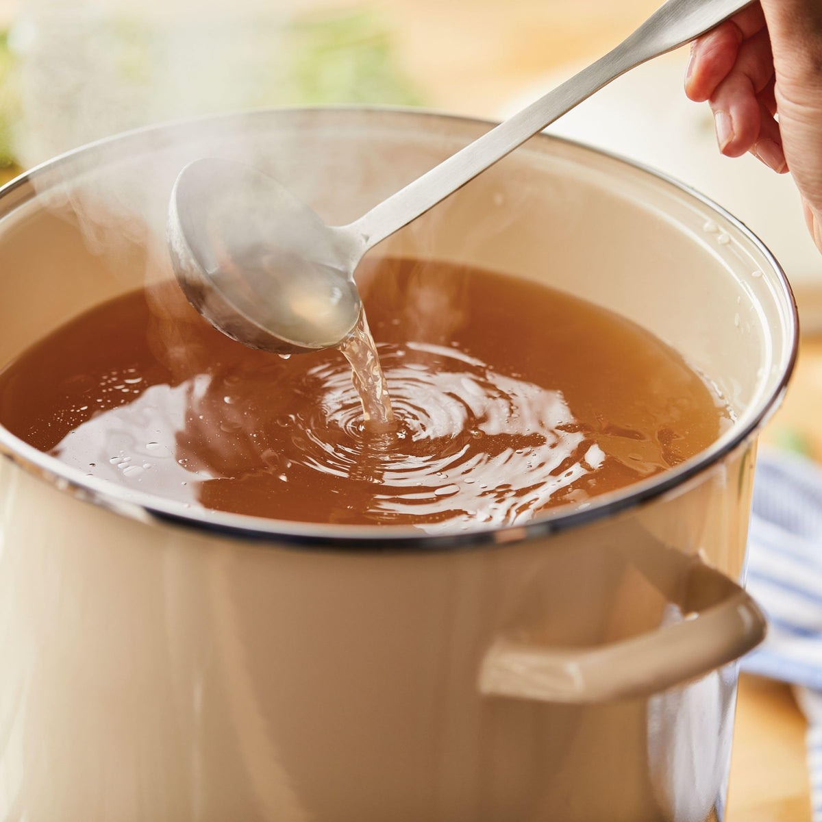 Rachael Ray enamel stockpot with sturdy handles for easy lifting.