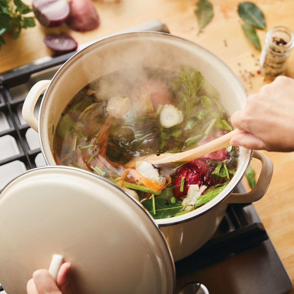 Rachael Ray enamel stockpot on induction cooktop, compatible and reliable.