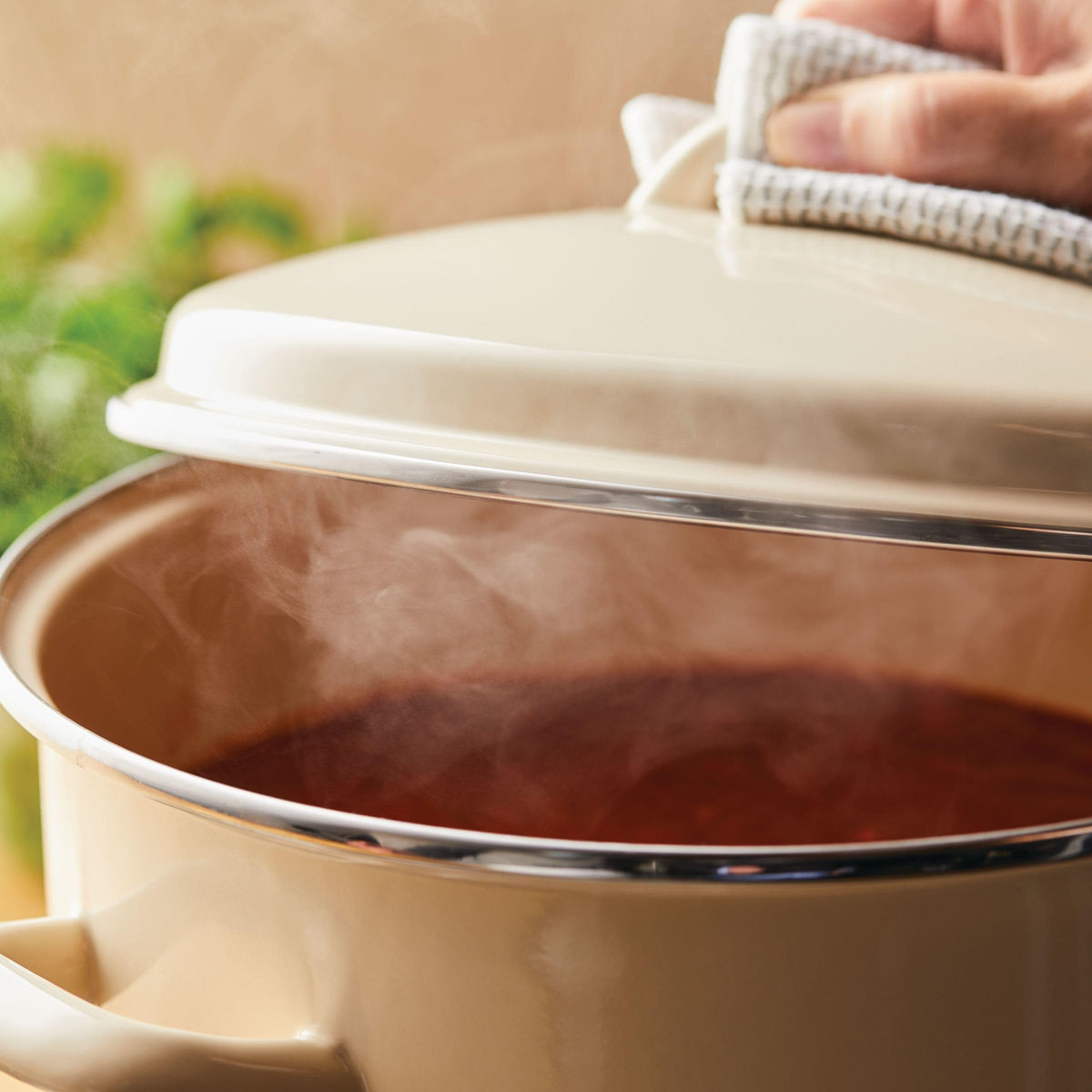 Rachael Ray 12-quart stockpot brimming with soup, ideal for one-pot meals.