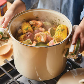 Rachael Ray stockpot lid on, snug seal preserves heat and flavor.