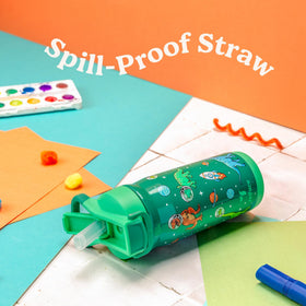 REDUCE Hydrate Pro Kids bottle by a backpack for travel-ready hydration.