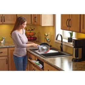 Rev-A-Shelf tip-out tray hinges close-up showing self-holding design for easy setup.