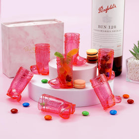 Rose red boot glasses double as decor and functional serving pieces.