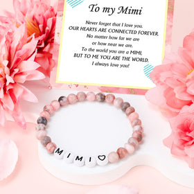 Saineron Mimi scented candle releasing a floral fragrance for relaxation.