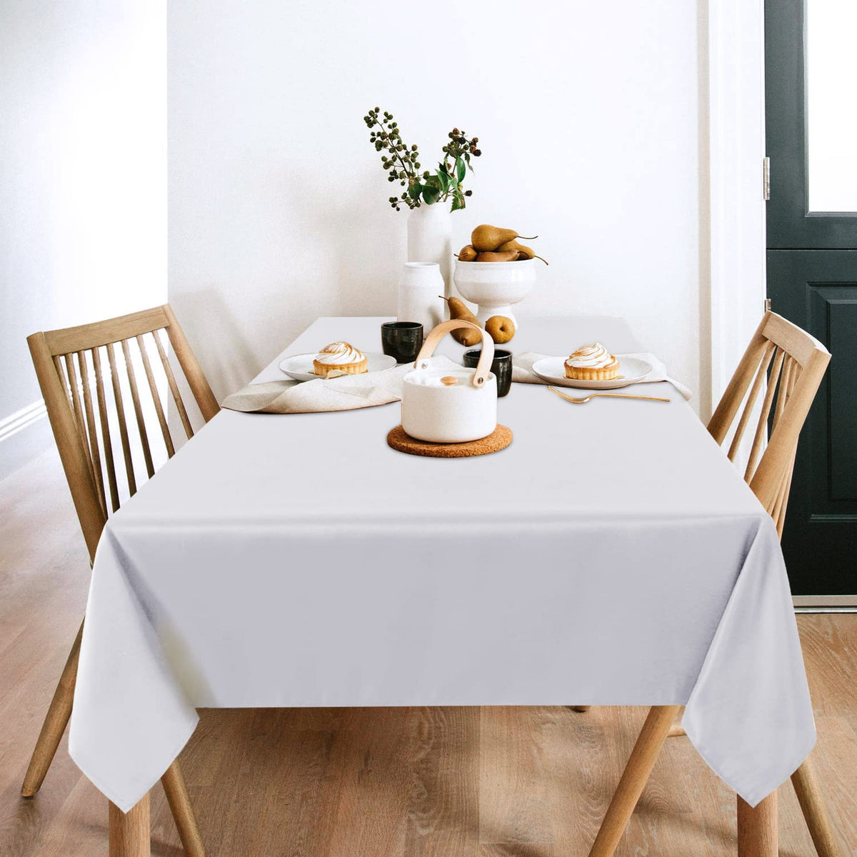 Sancua tablecloth draped over a dining setup with crisp, wrinkle-free drape.