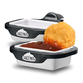Saucemoto Dip Clip on a car vent keeps sauces tidy during drives.