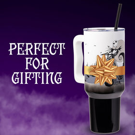 Tumbler features a secure sliding lid and straw for easy sipping.
