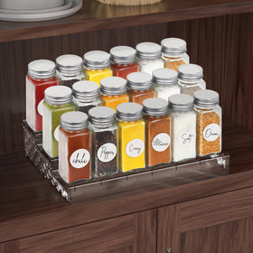Simple Houseware bottles arranged on a shelf demonstrate compact kitchen organization.