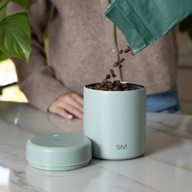 Delta coffee canister shows ceramic-lined interior protecting aromas.
