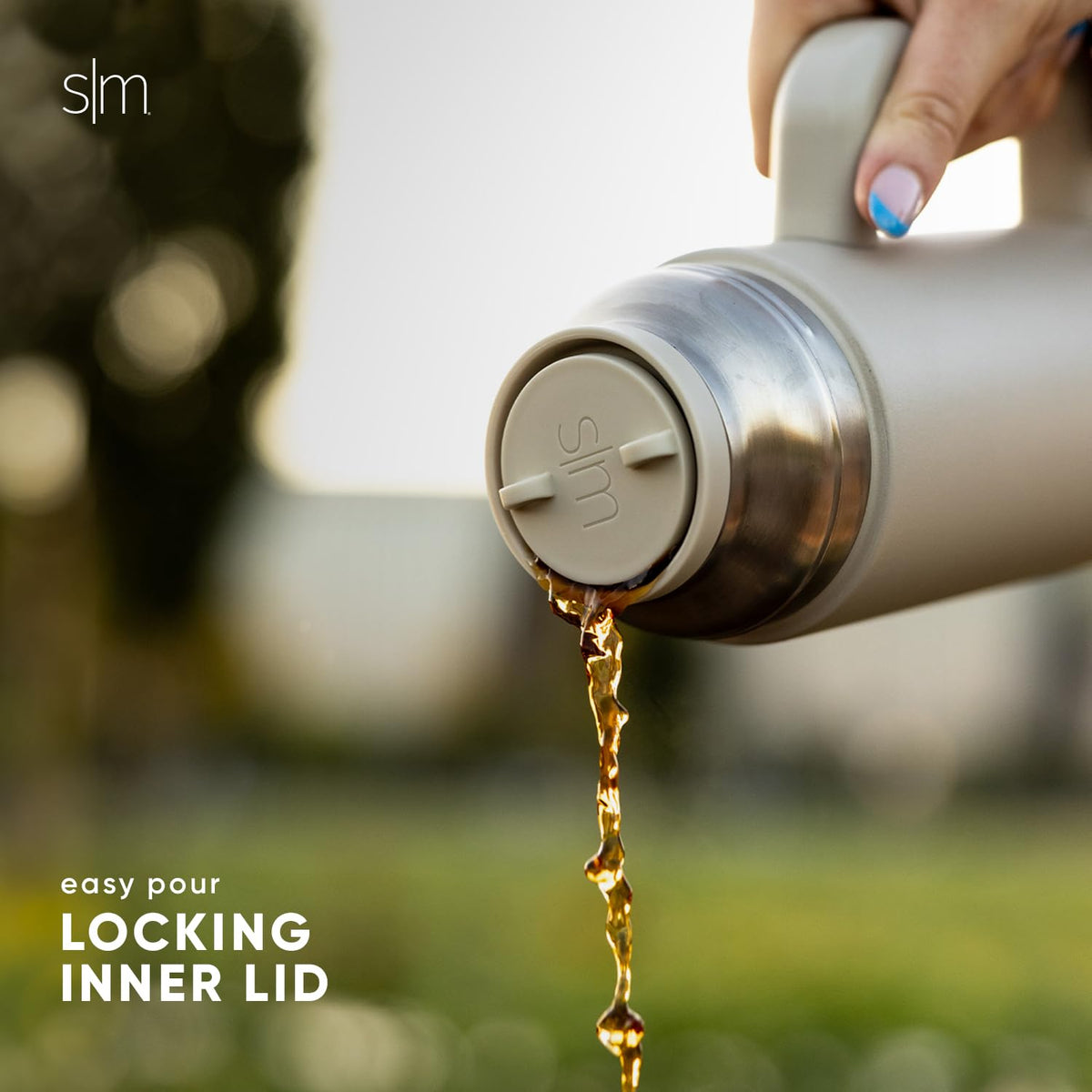 Stainless steel Roam bottle with a sturdy carry handle.