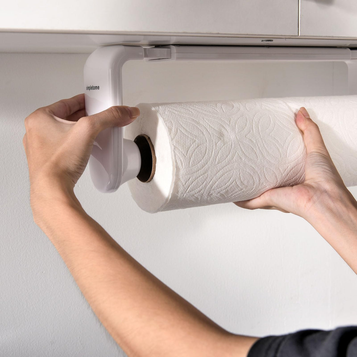 Adhesive installation on tiles or glass for clean, temporary mounting with Simpletome.