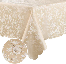 Smiry floral embossed tablecloth in beige with scalloped edges enhances dining ambiance