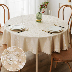 Smiry round beige table cloth with embossed floral pattern enhances everyday dining elegance.