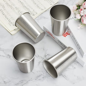 SMLIXE four-pack 24oz pint cups, in hand, comfortable grip.