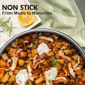 SNOWCLAD hybrid nonstick dual surface close-up highlights reduced oil use and easy cleaning.