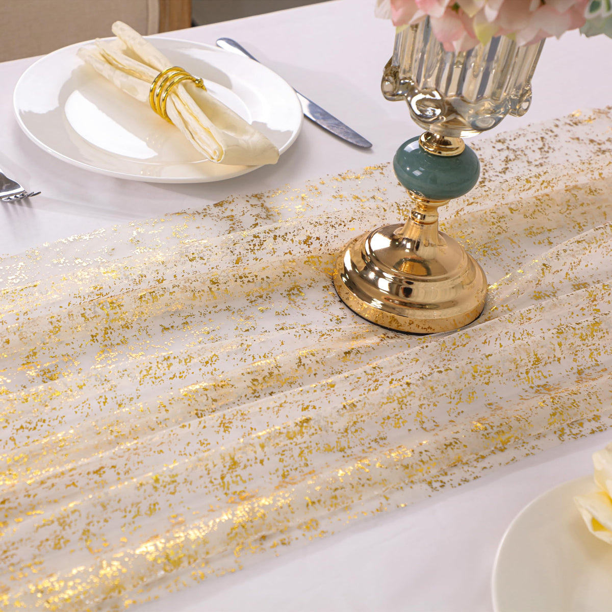 Snowkingdom wedding decor gold runner creates romantic ambiance for reception.