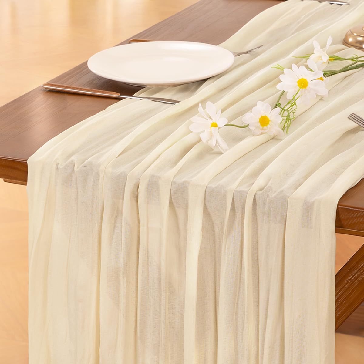 Socomi beige cheesecloth table runner 120in creates natural warmth on a dining table.
