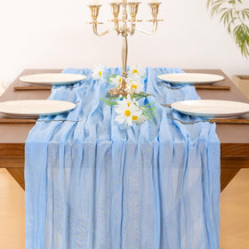 Socomi blue cheesecloth runner for Valentines Day creates soft, inviting dining vibes.