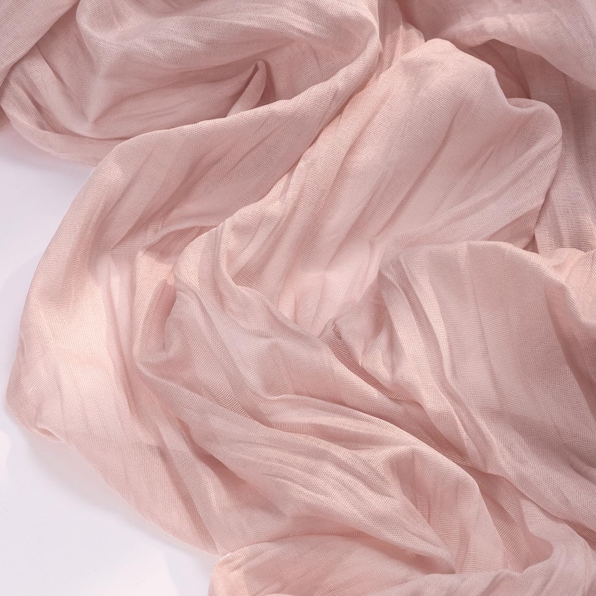 Socomi cheesecloth runner unrolled for baby shower centerpiece with soft texture.