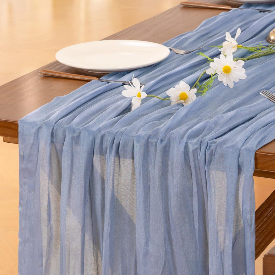 Socomi dusty blue cheesecloth table runner 120 inches adds airy elegance to wedding tables.