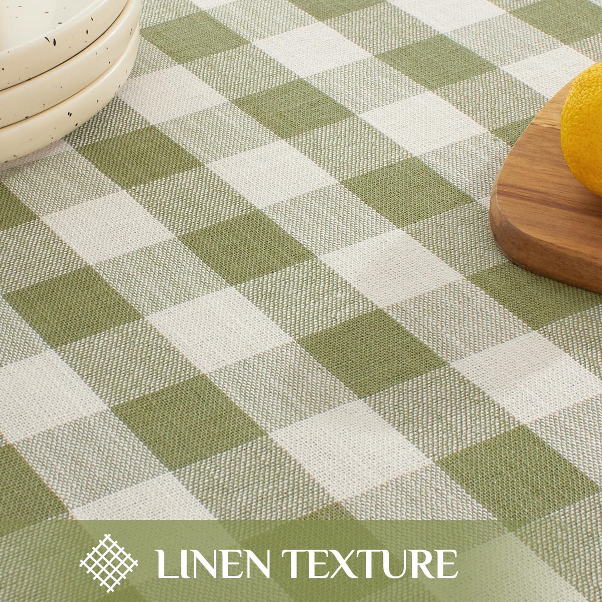 Softalker sage checkered tablecloth protects surfaces during outdoor meals.