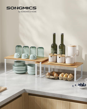 Songmics stackable shelves configured to maximize cabinet space and organization.