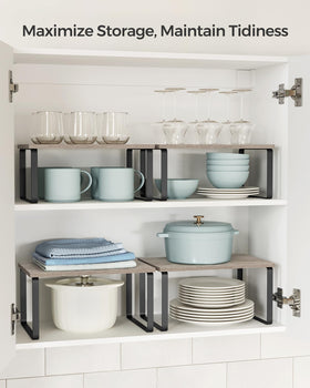 Songmics stackable shelves in ink black maximize counter space and organization.