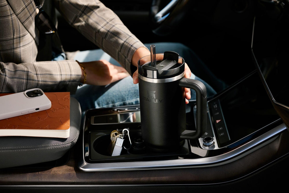 Stanley Quencher H2.0 30oz fits most cup holders for travel-ready convenience.