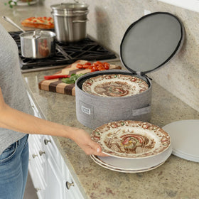 STOZU hard-shell container provides sturdy protection for stacked dinnerware.