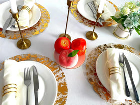 Sunlunckystar bulk-pack gold placemats simplify large gatherings.