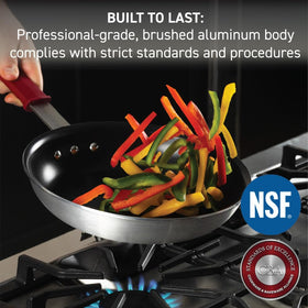 T-Fal VX3 fry pan close-up on stainless-steel handle and removable silicone sleeve