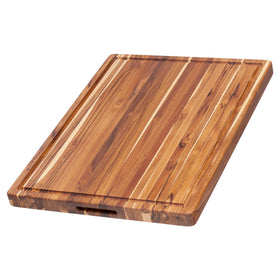 Teakhaus XL cutting board with juice groove for contained juices during carving