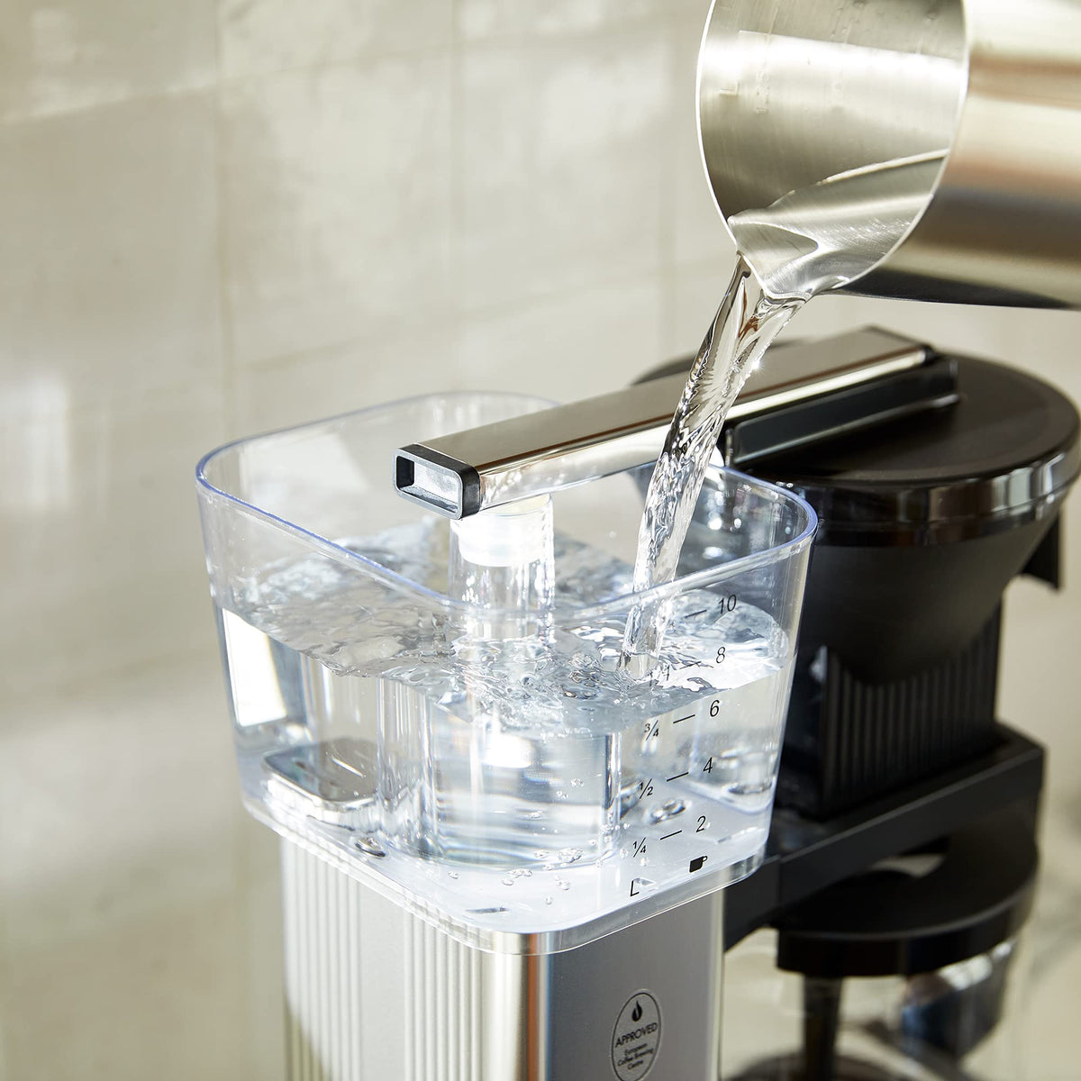 Technivorm Moccamaster KBGV orange brew-selector demonstrates half or full carafe options for flexible brewing.