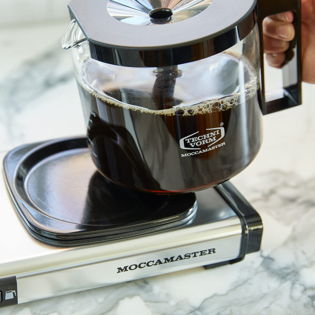 Technivorm Moccamaster KBGV orange compact design fits countertops without crowding.