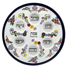 The Dreidel Company Passover plate, 12 inches, with turquoise blooms enhances table decor.