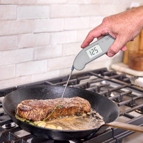 Thermapen ONE Dove Grey probe close-up showing fast readings for precise cooking.