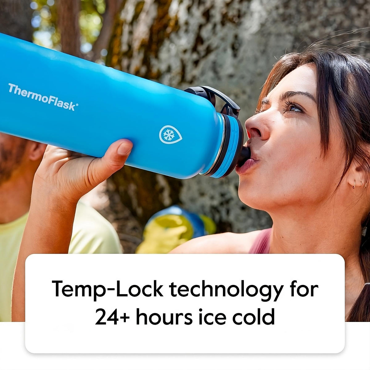 ThermoFlask 24 oz bottle with chug lid in use, perfect for gym sessions.