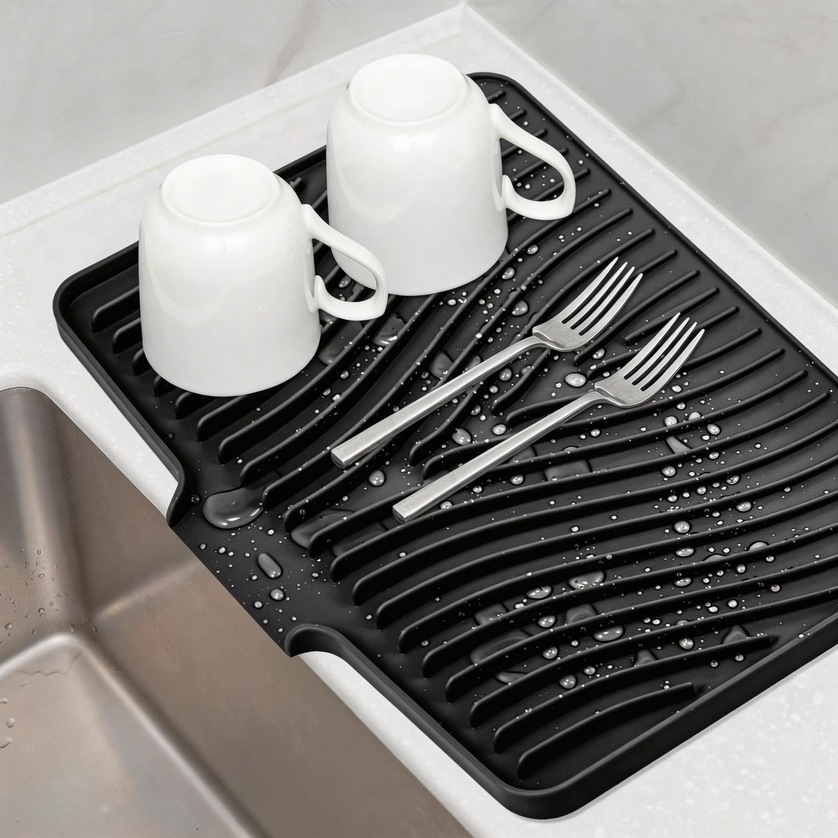 TIKNIK silicone dish drying mat 16x12 on counter with built-in drain for air drying.