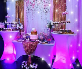 Tina's white spandex covers offer reusable decor for multiple events.