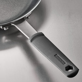Oven-ready Tramontina Fusion pan up to 400°F with removable silicone sleeve