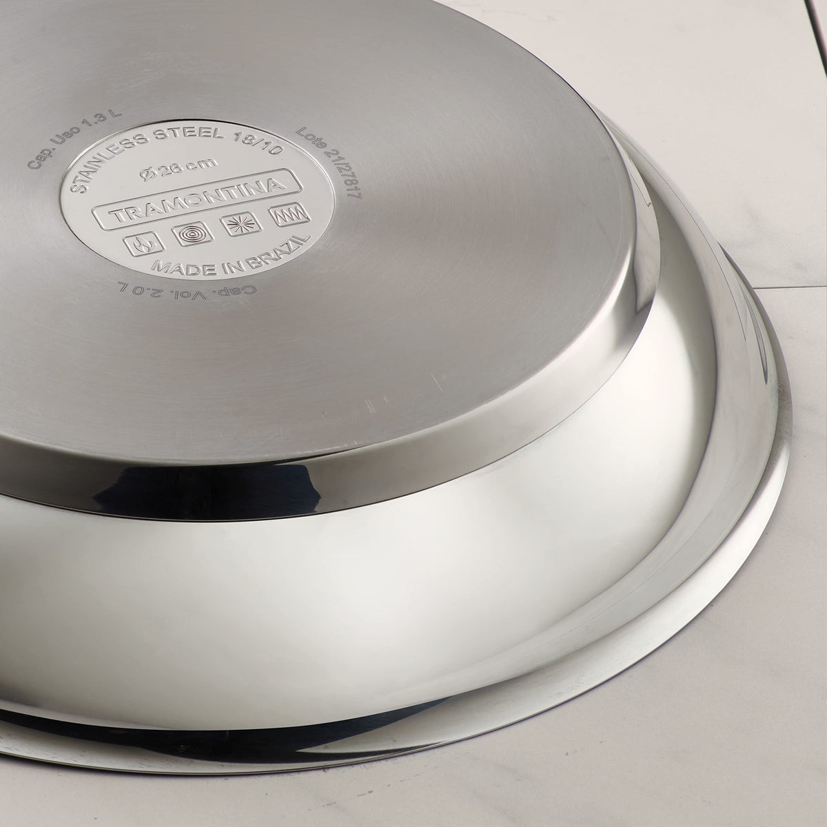 Tramontina riveted stainless-steel handle closeup highlights sturdy, secure grip