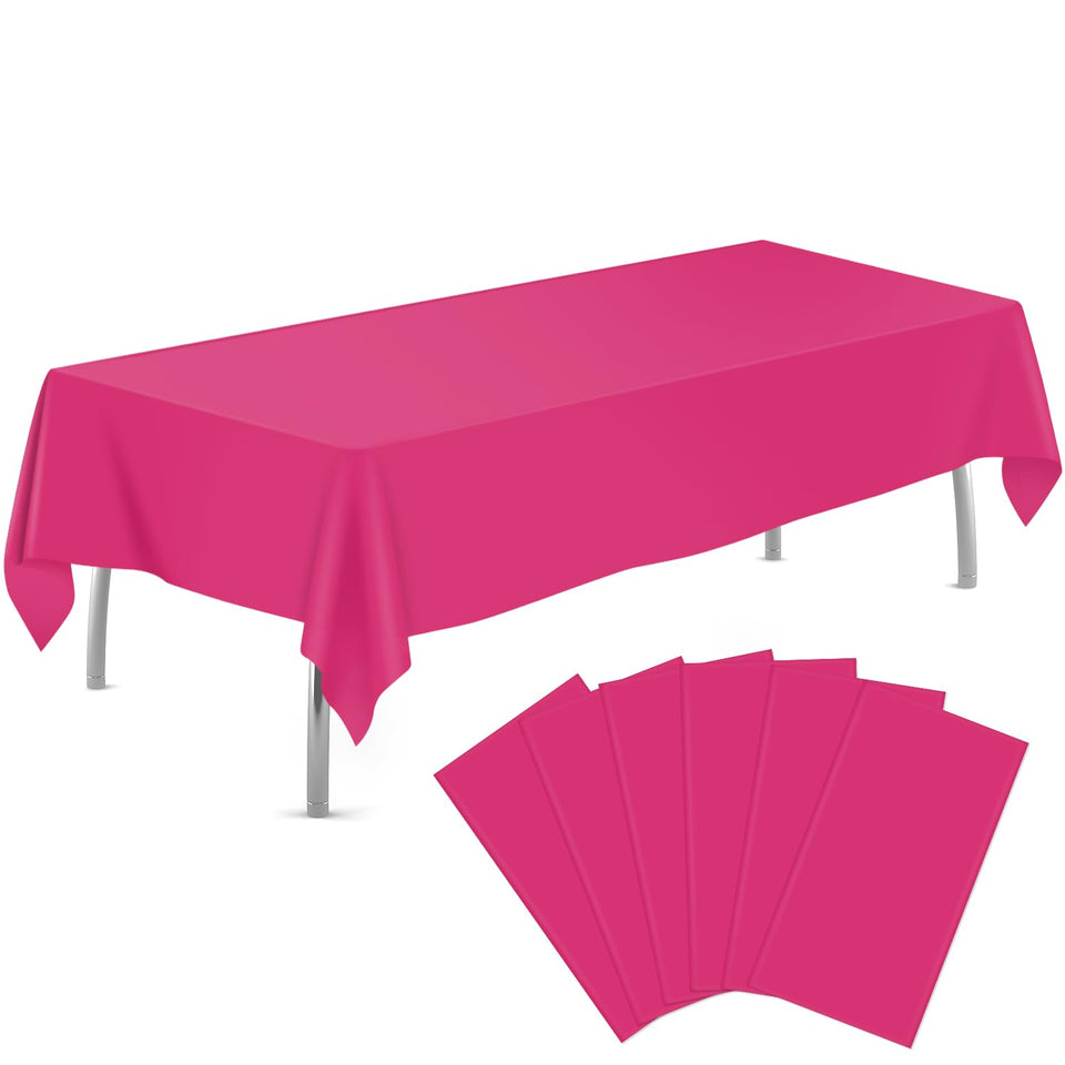 Tujol hot pink 54x108 tablecloth rolled for quick cleanup after gatherings.