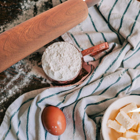 TUSIWIT rolling pin being hand-washed, promoting easy cleaning after use.